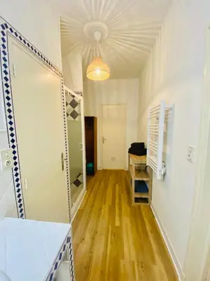 a hallway with a mirror and a dressing room at Hyper centre - Ecusson in Castres