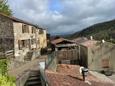 a view of a village with buildings and roofs at Le balcon d hautpoul in Mazamet