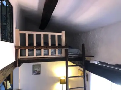 a bedroom with two bunk beds in a room at Le balcon d hautpoul in Mazamet
