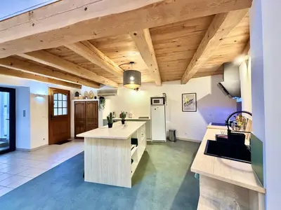 a dining room with a table and chairs at La maison de Lalie in Lagrasse