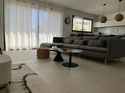 a living room with a couch and a table at Maison quartier la Campane Narbonne in Narbonne