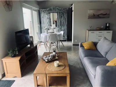 a living room with a couch and a table at Studio Peyresol in Villasavary