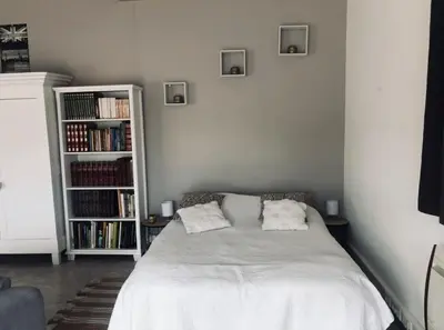 a bedroom with a bed with two pillows on it at Studio Peyresol in Villasavary
