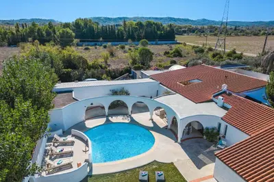 an aerial view of a house with a swimming pool at Villa Les Arches by Villa Plus in Villedaigne