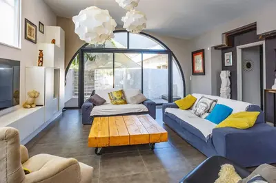 a living room with two couches and a coffee table at Villa Saffron by Villa Plus in Villedaigne