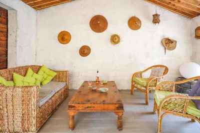 a living room with a couch and a table at Villa Le Petit Nid by Villa Plus in Villedaigne