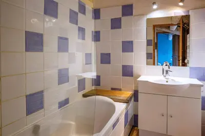 a bathroom with a tub and a sink at Villa Fraisse by Villa Plus in Fraissé-des-Corbières
