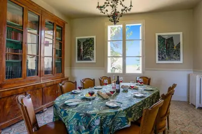 a dining room with a table and chairs at Villa Domaine du Midi by Villa Plus in Capestang