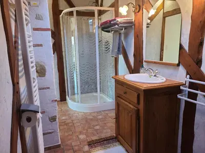 a bathroom with a shower and a sink and a mirror at - - - - -Les Colombages - - - - Chambre d'hôtes-Gîte- Classement Gîte 3 étoiles in Mirepoix