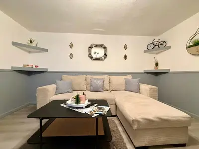a living room with a couch and a table at La Bastide in Carcassonne