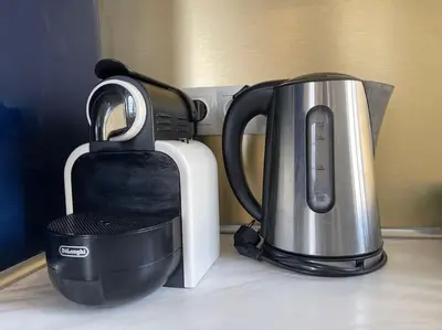 a coffee maker and a toaster on a counter at Chez Pierrot - Pont-Neuf - Vue Cité Médiévale in Carcassonne