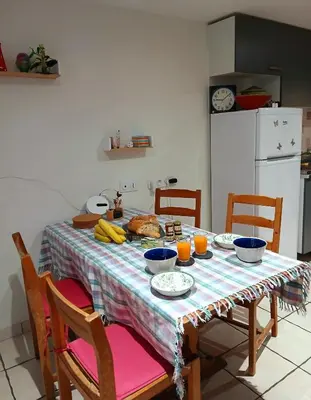 a dining room table with a plate of food on it at 5bis in Quillan