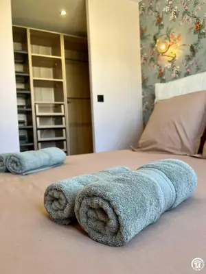 a blue towel is laying on a bed at Gite sainte louise in Narbonne