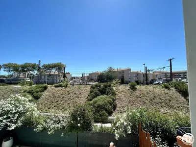 a garden with bushes and flowers on a hill at Gite sainte louise in Narbonne