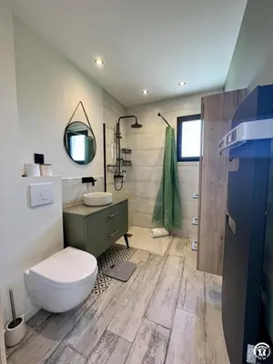 a bathroom with a toilet and a sink at Gite sainte louise in Narbonne