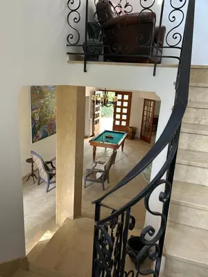 a stairway with a ping pong table in a room at Gîte les Mercieres la Villa Maison campagne grands espaces oasis de nature, convivialité, détente 5 Chambres piscine chauffée Wifi piano billard in Pexiora