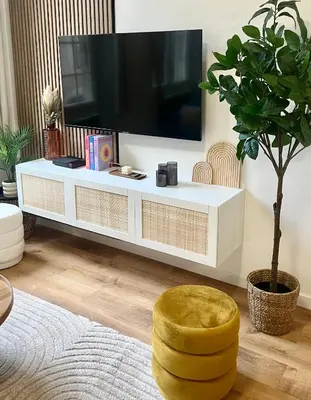 a living room with a tv and a yellow stool at Luxueux appartement cosy, hypercentre Castres in Castres