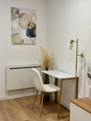 a white room with a desk and a chair at Golden Duplex Chic - Centre-Clim-Parking in Narbonne