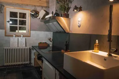 a kitchen with a sink and a counter top at Fount Estremiero Apartment wellness and pool shared with B&B in Castans