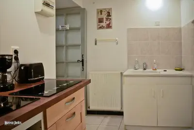 a kitchen with a sink and a counter top at Oustal de Papé le calme au cœur de Mirepoix in Mirepoix
