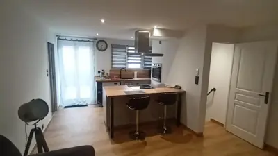 a kitchen with a counter with a sink and a kitchen with a counter at Appartement calme in Salses-le-Chateau