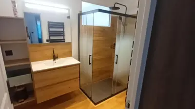 a bathroom with a shower and a sink at Appartement calme in Salses-le-Chateau