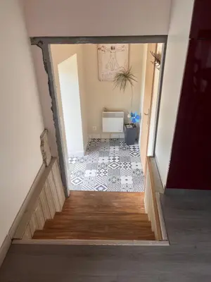 a view of a hallway with a stairway at Gîte Appartement à la campagne in Lautrec