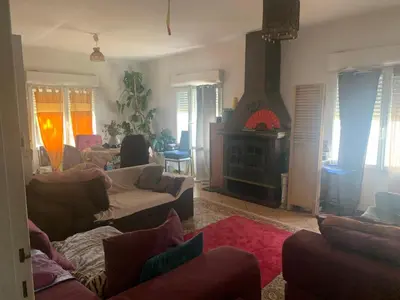 a living room with couches and a fire place at Loft cosy in Carcassonne