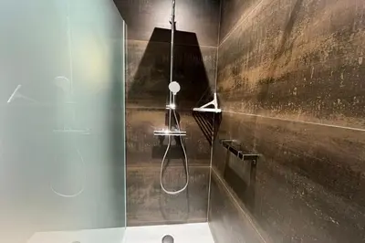 a bathroom with a shower with a shower head at Ostau Agradiu - Maison de maître proche de la Mer in Peyriac-de-Mer