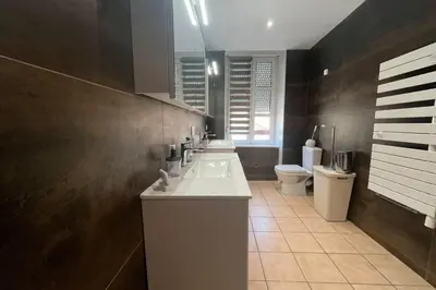 a bathroom with two sinks and a toilet at Ostau Agradiu - Maison de maître proche de la Mer in Peyriac-de-Mer
