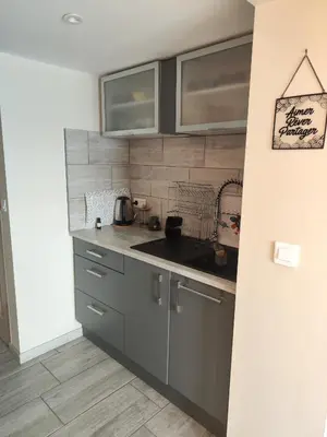 a kitchen with a sink and a counter top at Studio Goya climatisé et jardin 2 nuits minimum in Castres