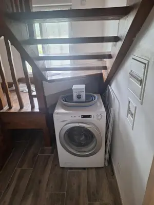 a washer and dryer in a small room at Chez Loulou du Linas - Bugarach in Bugarach