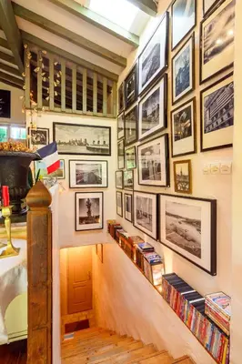 a living room with a fireplace with a statue at Moulin St Pierre bord - Au calme en bord de Rivière in Limoux