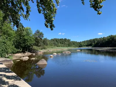 a view of a river with rocks and trees at Le repaire du châtaignier, Maison à la campagne, 8 pers, 4 ch, Sidobre in Ferrières