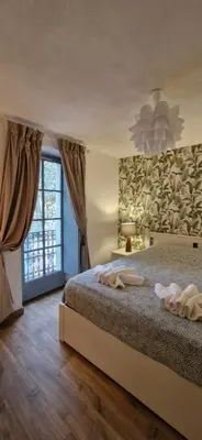 a bedroom with a bed with two towels on it at Via Narbona in Narbonne