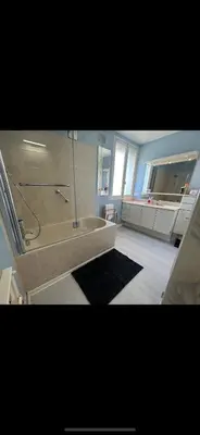 a kitchen with a tiled floor and a large window at Chambre Familiale Tetris in Castres