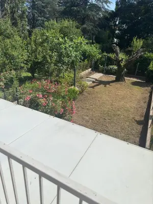 a view of a garden from the balcony of a house at Chambre Quattro avec Balcon CASTRES in Castres