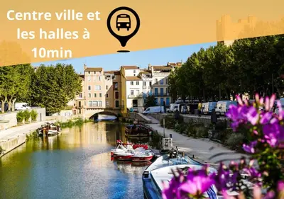 a picture of a river with boats and buildings at Maison Jade - Villa avec piscine - Barbecue - Calme in Narbonne