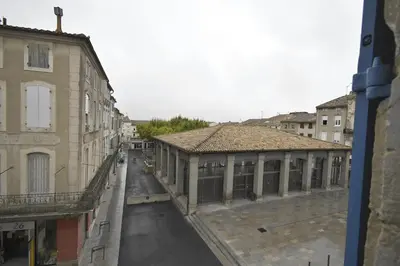 an empty street in a city with buildings at Le grand Castel in Castelnaudary
