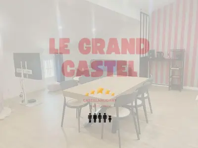 a room with a white table with wine bottles on it at Le grand Castel in Castelnaudary