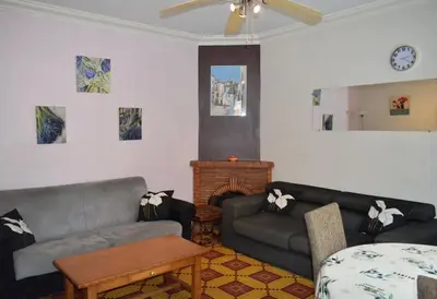 a living room with two couches and a fireplace at Family Friendly Gite in Quillan in Quillan