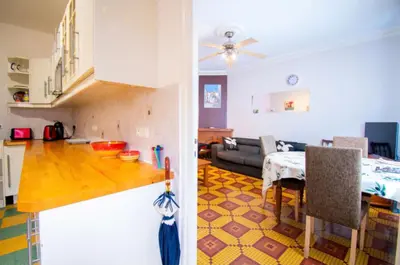 a kitchen and a living room with a table at Family Friendly Gite in Quillan in Quillan
