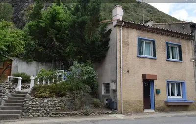 a small house with stairs leading up to it at Family Friendly Gite in Quillan in Quillan
