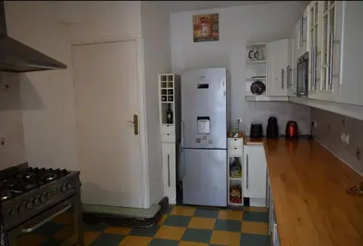 a kitchen with a white refrigerator and a stove at Family Friendly Gite in Quillan in Quillan