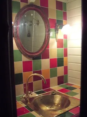 a bathroom with a sink and a mirror at La Hulotte in Mazamet