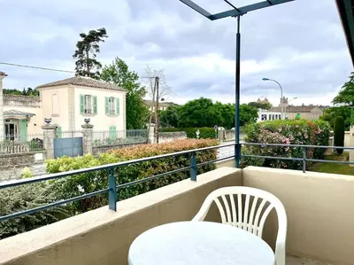 a white table and chairs on a balcony with a view at 147 - Vue Cité Médiévale et Parking in Carcassonne