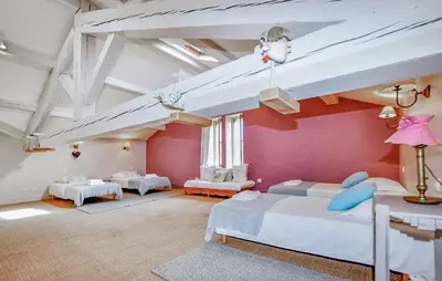 a large room with two beds and a loft at Lovely Home In Narbonne in Narbonne