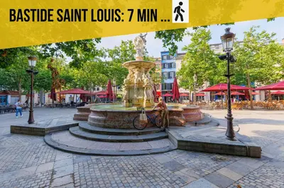 a fountain in the middle of a city street at Le Gîte Médiéval - Clim - Lave Linge - Cité in Carcassonne