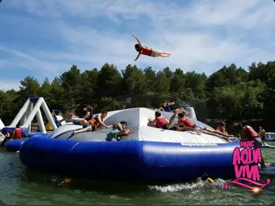 a group of people riding on a raft in the water at Appartement climatisé avec vue sur la cité in Carcassonne