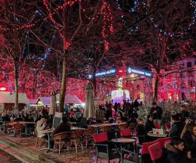 a crowd of people sitting at tables at a christmas event at Appartement climatisé avec vue sur la cité in Carcassonne